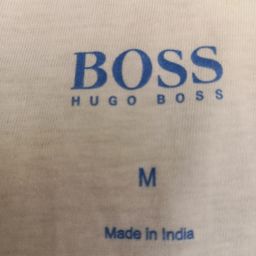 Boss logo tagless pad printing on single jersey knit cotton fabric |HUGO BOSS garment branding |BOSS neck label printing |BOSS apparel logo printing |BOSS inner neck print |luxury apparel tagless printing |premium garment branding |BOSS hoodie label printing |BOSS t-shirt neck print |custom fashion label printing |high-end apparel printing |textile pad printing for fashion brands
        
