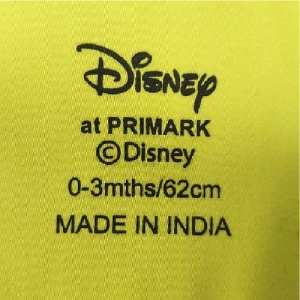  garment neck label print on cotton-rich babywear fabric |silicone pad printing on textile |textile logo printing |garment heat transfer alternative | apparel branding solutions |textile ink printing