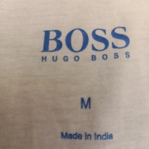 Boss | Tagless garment neck label print on Cotton-polyester blend |Tagless Garment Neck Label Print on Cotton-Polyester Blend | Cotton Polyester Blend Fabric | Poly Cotton Fabric | Cotton Poly Knit Fabric | Cotton Polyester Jersey Knit | Poly Cotton Jersey Fabric | Cotton Rich Blend Fabric | Cotton Polyester Interlock Fabric | Cotton Polyester Rib Fabric | Cotton Polyester Pique Fabric | Cotton Polyester Melange Fabric | Heather Fabric | Marl Fabric | Cotton Poly Lycra Fabric | Cotton Poly Spandex Fabric | Stretch Blend Fabric | Soft Touch Knit Fabric | Breathable Apparel Fabric | Lightweight Knit Fabric | Performance Blend Fabric | Hosiery Knit Fabric | Casualwear Fabric | Sportswear Fabric | Activewear Fabric | Athleisure Fabric | T-Shirt Fabric | Polo Shirt Fabric | Sweatshirt Fabric | Hoodie Fabric | Kidswear Fabric | Fashion Knitwear Fabric | Tagless Garment Neck Label Print | Tagless Neck Label Printing | Printed Neck Label | Inner Neck Printing | Neck Branding Print | Garment Label Printing